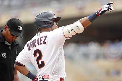 Jul 16, 2022; Minneapolis, Minnesota, USA; Minnesota Twins first baseman Luis Arraez (2) points to the crowd to celebrate his solo home run against the Chicago White Sox in the first inning at Target Field. Mandatory Credit: Bruce Kluckhohn-USA TODAY Sports