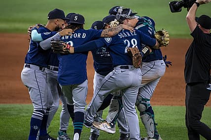 Jul 16, 2022; Arlington, Texas, USA; The Seattle Mariners celebrate the win over the Texas Rangers at Globe Life Field. Mandatory Credit: Jerome Miron-USA TODAY Sports