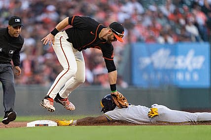 Jul 16, 2022; San Francisco, California, USA; San Francisco Giants third baseman Evan Longoria (10) tags out Milwaukee Brewers center fielder Jonathan Davis (3) at Oracle Park. Mandatory Credit: Stan Szeto-USA TODAY Sports