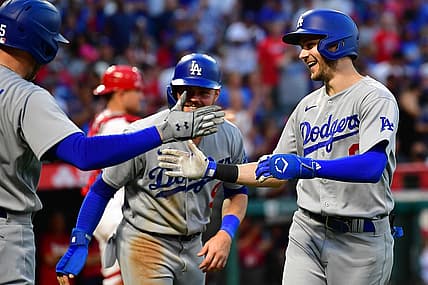 Jul 16, 2022; Anaheim, California, USA; Los Angeles Dodgers shortstop Trea Turner (6) is greeted by first baseman Freddie Freeman (5) and second baseman Gavin Lux (9) after hitting a two run home run against the Los Angeles Angels during the third inning at Angel Stadium. Mandatory Credit: Gary A. Vasquez-USA TODAY Sports