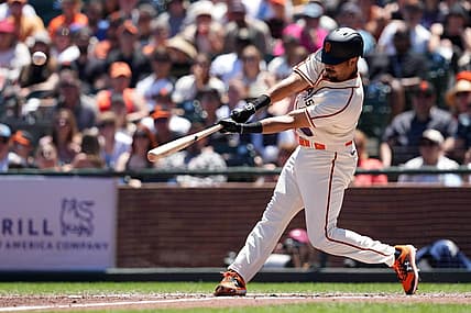 Jul 17, 2022; San Francisco, California, USA; San Francisco Giants first baseman LaMonte Wade Jr. (31) hits a home run against the Milwaukee Brewers during the third inning at Oracle Park. Mandatory Credit: Darren Yamashita-USA TODAY Sports