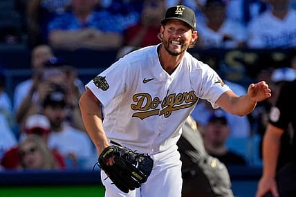 Jul 19, 2022; Los Angeles, California, USA; National League starting pitcher Clayton Kershaw (22) of the Los Angeles Dodgers reacts after giving up a single to American League pitcher/designated hitter Shohei Ohtani (17) of the Los Angeles Angels during the first inning in the 2022 MLB All Star Game at Dodger Stadium. Mandatory Credit: Robert Hanashiro-USA TODAY Sports