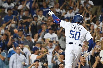 Jul 21, 2022; Los Angeles, California, USA; Los Angeles Dodgers right fielder Mookie Betts (50) celebrates hitting a three run home run in the eighth inning against the San Francisco Giants at Dodger Stadium. Mandatory Credit: Richard Mackson-USA TODAY Sports