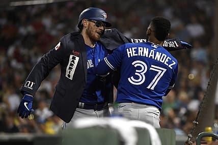 Jul 22, 2022; Boston, Massachusetts, USA; Toronto Blue Jays right fielder Teoscar Hernandez (37) puts a jacket on catcher Danny Jansen (9) after hitting a home run during the fourth inning against the Boston Red Sox at Fenway Park. Mandatory Credit: Bob DeChiara-USA TODAY Sports