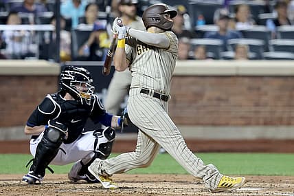 Jul 22, 2022; New York City, New York, USA; San Diego Padres first baseman Eric Hosmer (30) follows through on a two run home run against the New York Mets during the fourth inning at Citi Field. Mandatory Credit: Brad Penner-USA TODAY Sports