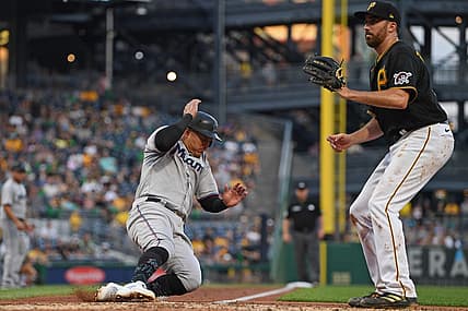 Jul 22, 2022; Pittsburgh, Pennsylvania, USA; Miami Marlins right fielder Avisail Garcia (24) scores a run on a wild pitch by Pittsburgh Pirates starting pitcher Zach Thompson (39) during the fourth inning at PNC Park. Mandatory Credit: David Dermer-USA TODAY Sports