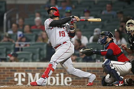 Jul 22, 2022; Atlanta, Georgia, USA; Los Angeles Angels third baseman Jonathan Villar (19) hits a home run against the Atlanta Braves in the ninth inning at Truist Park. Mandatory Credit: Brett Davis-USA TODAY Sports