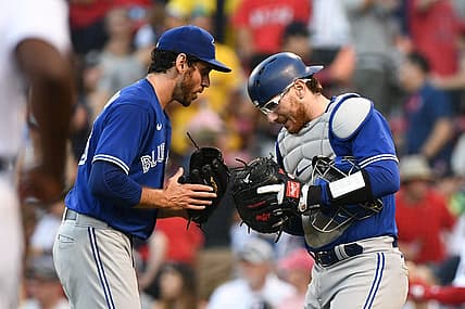 Jul 23, 2022; Boston, Massachusetts, USA; Toronto Blue Jays relief pitcher Jordan Romano (68) and catcher Danny Jansen (9) celebrate after beating the Boston Red Sox at Fenway Park. Mandatory Credit: Brian Fluharty-USA TODAY Sports