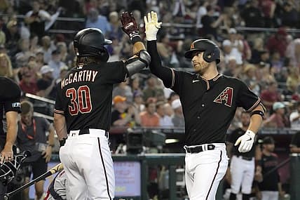 Jul 23, 2022; Phoenix, Arizona, USA; Arizona Diamondbacks first baseman Christian Walker (53) celebrates with center fielder Jake McCarthy (30) after hitting a solo home run against the Washington Nationals in the third inning at Chase Field. Mandatory Credit: Rick Scuteri-USA TODAY Sports