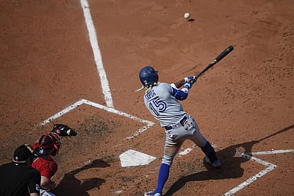 Jul 24, 2022; Boston, Massachusetts, USA;  Toronto Blue Jays left fielder Raimel Tapia (15) hits an RBI single during the fifth inning against the Boston Red Sox at Fenway Park. Mandatory Credit: Bob DeChiara-USA TODAY Sports
