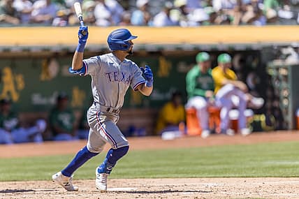 Jul 24, 2022; Oakland, California, USA; Texas Rangers center fielder Leody Taveras (3) grounds a single to load the bases against the Oakland Athletics during the fifth inning at RingCentral Coliseum. Mandatory Credit: John Hefti-USA TODAY Sports