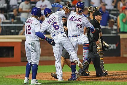 Jul 24, 2022; New York City, New York, USA; New York Mets first baseman Pete Alonso (20) celebrates with right fielder Starling Marte (6) and shortstop Francisco Lindor (12) after hitting a three run home run during the sixth inning against the San Diego Padres at Citi Field. Mandatory Credit: Vincent Carchietta-USA TODAY Sports