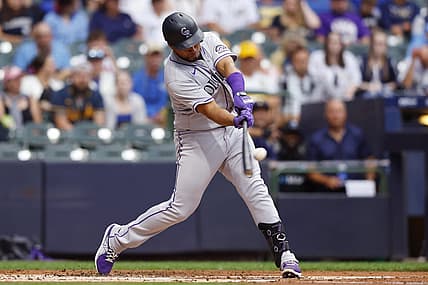 Jul 25, 2022; Milwaukee, Wisconsin, USA;  Colorado Rockies catcher Elias D az (35) hits a home run during the third inning against the Milwaukee Brewers at American Family Field. Mandatory Credit: Jeff Hanisch-USA TODAY Sports