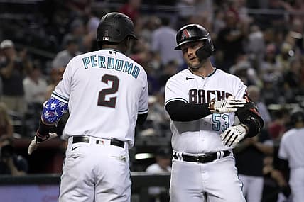 Jul 26, 2022; Phoenix, Arizona, USA; Arizona Diamondbacks first baseman Christian Walker (53) celebrates with shortstop Geraldo Perdomo (2) after hitting a three-run homerun against the San Francisco Giants in the third inning at Chase Field. Mandatory Credit: Rick Scuteri-USA TODAY Sports