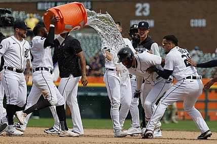 Jul 27, 2022; Detroit, Michigan, USA; Detroit Tigers right fielder Victor Reyes (22) receives congratulations from teammates after he hits a walk off two RBI double in the ninth inning against the San Diego Padres at Comerica Park. Mandatory Credit: Rick Osentoski-USA TODAY Sports