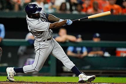 Jul 27, 2022; Baltimore, Maryland, USA;  Tampa Bay Rays left fielder Randy Arozarena (56) hits a two run double in the tenth inning against the Baltimore Orioles at Oriole Park at Camden Yards. Mandatory Credit: Tommy Gilligan-USA TODAY Sports