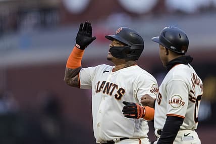 Jul 28, 2022; San Francisco, California, USA;  San Francisco Giants designated hitter Yermin Mercedes (6) reacts next to first base coach Antoan Richardson (00) after hitting a bases-loaded two-run single against the Chicago Cubs during the third inning at Oracle Park. Mandatory Credit: John Hefti-USA TODAY Sports