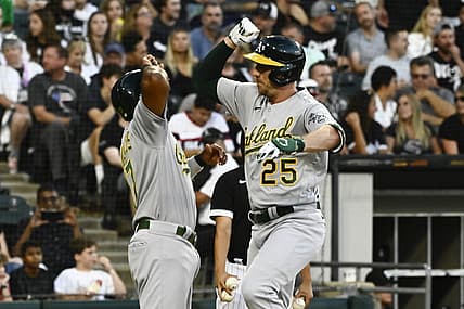 Jul 29, 2022; Chicago, Illinois, USA;  Oakland Athletics right fielder Stephen Piscotty (25) right, high fives Oakland Athletics shortstop Elvis Andrus (17) after they score on Piscotty's  three-run home run against the Chicago White Sox during the second inning at Guaranteed Rate Field. Mandatory Credit: Matt Marton-USA TODAY Sports