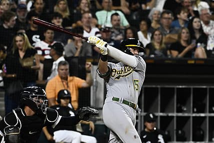 Jul 29, 2022; Chicago, Illinois, USA;  Oakland Athletics first baseman Seth Brown (15) hits a home run against the Chicago White Sox during the sixth inning at Guaranteed Rate Field. Mandatory Credit: Matt Marton-USA TODAY Sports