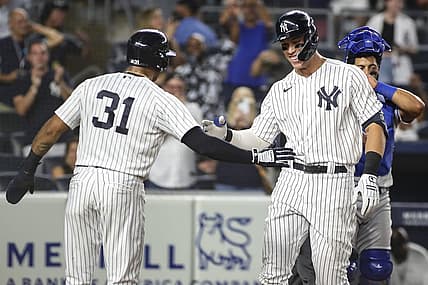 Jul 29, 2022; Bronx, New York, USA;  New York Yankees center fielder Aaron Hicks (31) greets right fielder Aaron Judge (99) after he hit a grand slam home run in the eighth inning against the Kansas City Royals at Yankee Stadium. Mandatory Credit: Wendell Cruz-USA TODAY Sports