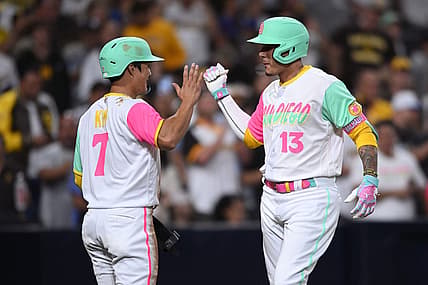 Jul 29, 2022; San Diego, California, USA; San Diego Padres third baseman Manny Machado (13) is congratulated by shortstop Ha-Seong Kim (7) after hitting a two-run home run during the fifth inning against the Minnesota Twins at Petco Park. Mandatory Credit: Orlando Ramirez-USA TODAY Sports