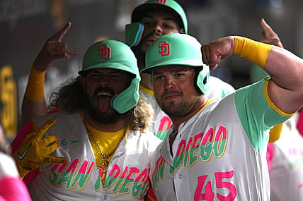 Jul 29, 2022; San Diego, California, USA; San Diego Padres catcher Jorge Alfaro (left) poses for a photograph with designated hitter Luke Voit (45) and first baseman Eric Hosmer (top, rear) after hitting a three-run home run against the Minnesota Twins during the fifth inning at Petco Park. Mandatory Credit: Orlando Ramirez-USA TODAY Sports