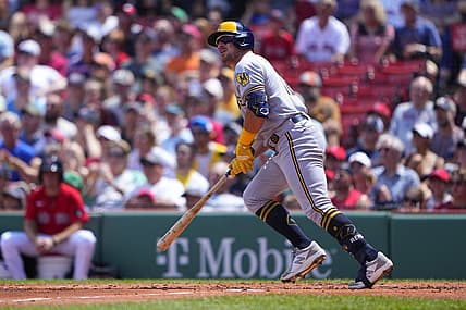 Jul 31, 2022; Boston, Massachusetts, USA; Milwaukee Brewers right fielder Hunter Renfroe (12) watches his two-run home run against the Boston Red Sox during the second inning at Fenway Park. Mandatory Credit: Gregory Fisher-USA TODAY Sports