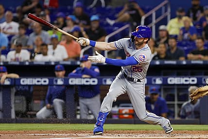 Jul 31, 2022; Miami, Florida, USA; New York Mets right fielder Tyler Naquin (25) hits a single during the first inning against the Miami Marlins at loanDepot Park. Mandatory Credit: Sam Navarro-USA TODAY Sports