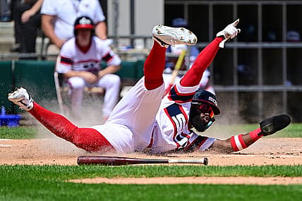 Jul 31, 2022; Chicago, Illinois, USA; Chicago White Sox second baseman Josh Harrison (5) celebrates while sliding at home to score in the second inning against the Oakland Athletics at Guaranteed Rate Field. Mandatory Credit: Quinn Harris-USA TODAY Sports