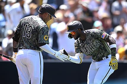 Jul 31, 2022; San Diego, California, USA; San Diego Padres left fielder Jurickson Profar (right) is congratulated by third baseman Manny Machado (13) after hitting a home run during the third inning against the San Diego Padres at Petco Park. Mandatory Credit: Orlando Ramirez-USA TODAY Sports