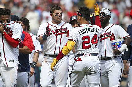 Jul 31, 2022; Atlanta, Georgia, USA; Atlanta Braves third baseman Austin Riley (27) celebrates with catcher William Contreras (24) after a game-winning RBI double against the Arizona Diamondbacks at Truist Park. Mandatory Credit: Brett Davis-USA TODAY Sports