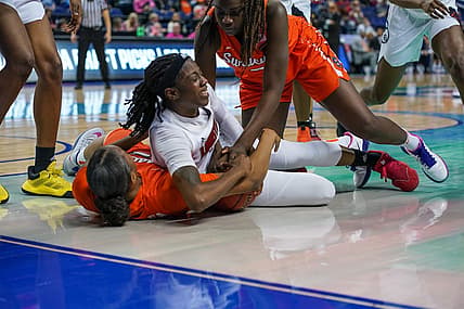 Mar 6, 2020; Greensboro, NC, UCA; Louisville Cardinals guard Jazmine Jones (23) tries to maintain possession against the Syracuse Orange during the first half at Greensboro Coliseum. Mandatory Credit: Jim Dedmon-USA TODAY Sports