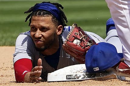 May 29, 2022; Chicago, Illinois, USA; Chicago Cubs infielder Andrelton Simmons (19) forces out Chicago White Sox shortstop Danny Mendick (20) at second base during the sixth inning at Guaranteed Rate Field. Mandatory Credit: David Banks-USA TODAY Sports