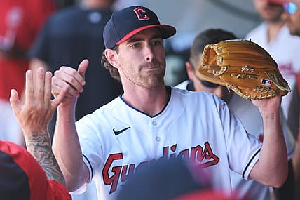 Jul 12, 2022; Cleveland, Ohio, USA; Cleveland Guardians starting pitcher Shane Bieber (57) celebrates in the dugout during the eighth inning against the Chicago White Sox at Progressive Field. Mandatory Credit: Ken Blaze-USA TODAY Sports