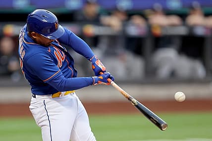 Jul 26, 2022; New York City, New York, USA; New York Mets third baseman Eduardo Escobar (10) hits a two run home run against the New York Yankees during the first inning at Citi Field. Mandatory Credit: Brad Penner-USA TODAY Sports