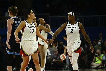 Jul 26, 2022; Chicago, IL, USA;  Las Vegas Aces guard Kelsey Plum (10) and Las Vegas Aces guard Riquna Williams (2) high five against the Chicago Sky during the second half of the Commissioners Cup-Championships at Wintrust Arena. Mandatory Credit: Matt Marton-USA TODAY Sports