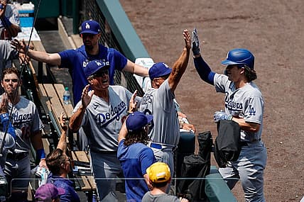 Jul 31, 2022; Denver, Colorado, USA; Los Angeles Dodgers right fielder James Outman (77) celebrates with manager Dave Roberts (30) and bench coach Bob Geren (88) after hitting a home run on his first career at bat in the first inning against the Colorado Rockies at Coors Field. Mandatory Credit: Isaiah J. Downing-USA TODAY Sports
