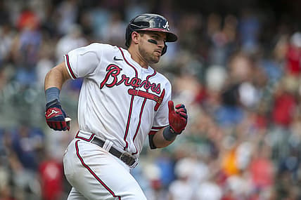 Jul 31, 2022; Atlanta, Georgia, USA; Atlanta Braves third baseman Austin Riley (27) hits a game-winning RBI double against the Arizona Diamondbacks in the ninth inning at Truist Park. Mandatory Credit: Brett Davis-USA TODAY Sports