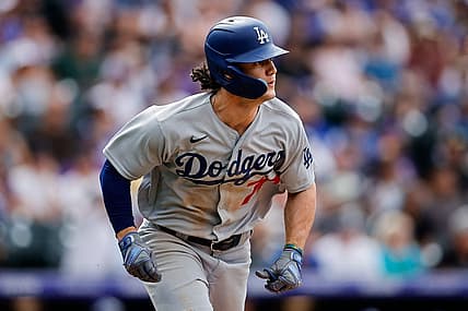 Jul 31, 2022; Denver, Colorado, USA; Los Angeles Dodgers right fielder James Outman (77) watches his ball on an RBI double in the eighth inning against the Colorado Rockies at Coors Field. Mandatory Credit: Isaiah J. Downing-USA TODAY Sports
