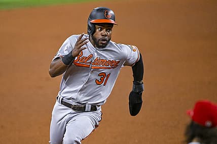 Aug 1, 2022; Arlington, Texas, USA; Baltimore Orioles center fielder Cedric Mullins (31) scores against the Texas Rangers during the fourth inning at Globe Life Field. Mandatory Credit: Jerome Miron-USA TODAY Sports