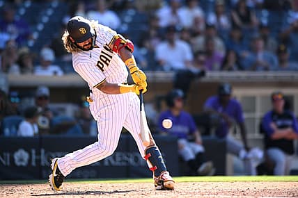 Aug 2, 2022; San Diego, California, USA; San Diego Padres designated hitter Jorge Alfaro (38) hits an RBI single during the seventh inning against the Colorado Rockies at Petco Park. Mandatory Credit: Orlando Ramirez-USA TODAY Sports