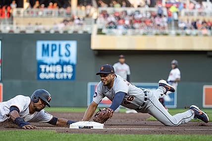 Aug 2, 2022; Minneapolis, Minnesota, USA; Minnesota Twins second baseman Luis Arraez (2) slides safely into third base beating the tag of Detroit Tigers third baseman Jeimer Candelario (46) during the third inning at Target Field. Mandatory Credit: Jordan Johnson-USA TODAY Sports