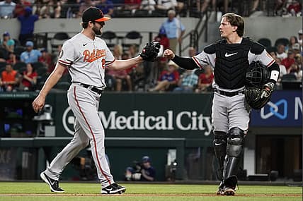 Aug 2, 2022; Arlington, Texas, USA; Baltimore Orioles starting pitcher Jordan Lyles (28) fist bumps catcher Adley Rutschman (35) after pitching the sixth inning against the Texas Rangers at Globe Life Field. Mandatory Credit: Raymond Carlin III-USA TODAY Sports
