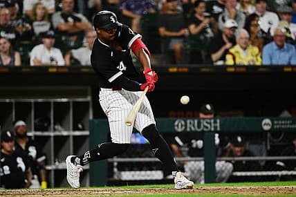 Aug 2, 2022; Chicago, Illinois, USA; Chicago White Sox left fielder Eloy Jimenez (74) hits a sacrifice fly in the sixth inning against the Kansas City Royals at Guaranteed Rate Field. Mandatory Credit: Quinn Harris-USA TODAY Sports