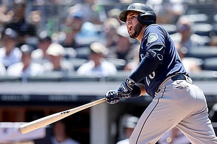 Aug 3, 2022; Bronx, New York, USA; Seattle Mariners third baseman Eugenio Suarez (28) follows through on a three run home run against the New York Yankees during the first inning at Yankee Stadium. Mandatory Credit: Brad Penner-USA TODAY Sports