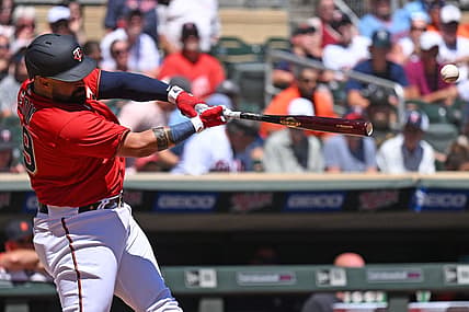 Aug 3, 2022; Minneapolis, Minnesota, USA; Minnesota Twins catcher Sandy Leon (39) hits a two-run RBI double against the Detroit Tigers during the second inning at Target Field. Mandatory Credit: Nick Wosika-USA TODAY Sports