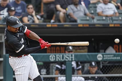Aug 3, 2022; Chicago, Illinois, USA; Chicago White Sox left fielder Eloy Jimenez (74) breaks his bat on a single against the Kansas City Royals during the third inning at Guaranteed Rate Field. Mandatory Credit: Kamil Krzaczynski-USA TODAY Sports