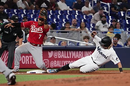 Aug 3, 2022; Miami, Florida, USA; Miami Marlins second baseman Luke Williams (46) steals third base ahead of the tag of Cincinnati Reds third baseman Donovan Solano (7) in the third inning at loanDepot Park. Mandatory Credit: Jasen Vinlove-USA TODAY Sports