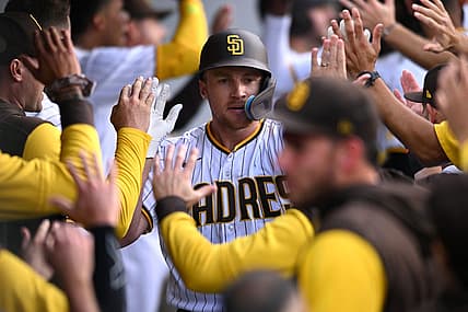 Aug 3, 2022; San Diego, California, USA; San Diego Padres designated hitter Brandon Drury (center) is congratulated in the dugout after hitting a grand slam home run during the first inning against the Colorado Rockies at Petco Park. Mandatory Credit: Orlando Ramirez-USA TODAY Sports
