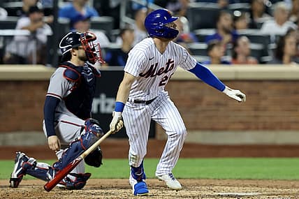 Aug 4, 2022; New York City, New York, USA; New York Mets left fielder Tyler Naquin (25) watches his solo home run against the Atlanta Braves during the sixth inning at Citi Field. Mandatory Credit: Brad Penner-USA TODAY Sports